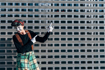 Mime happy gesticulating in the street