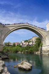 Fototapeta na wymiar Mostar with the Old Bridge houses and minarets in Bosnia and Herzegovina