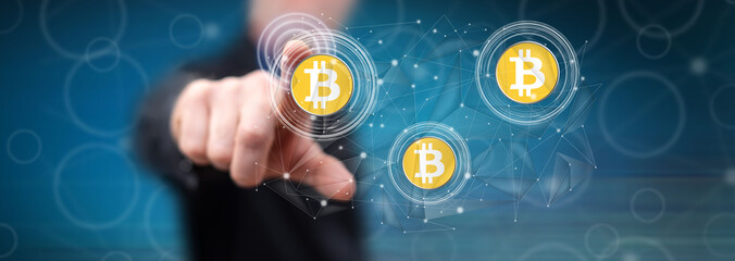Man touching a bitcoin currency concept