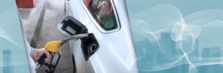 Man holding a fuel pump nozzle. panoramic banner