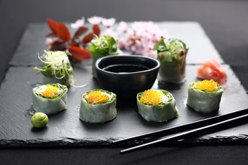Spring sushi, sushi rolls with salmon, rucola, philadelphia cheese.