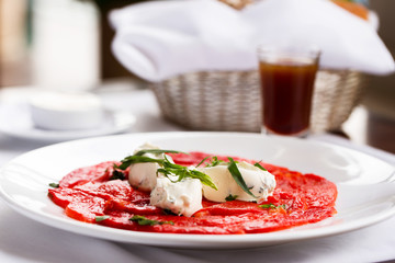 Salmon Carpaccio with cream cheese. Restaurant appetizzers.