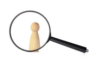human figure stands near a magnifying glass on a white background. The concept of the search for people and workers. Search for vacancies and work. Human resources, management