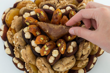 the special dried fruits and nuts plate concept for store seller. dried apricot,fig ,hazelnut, nut,special Turkish east food.