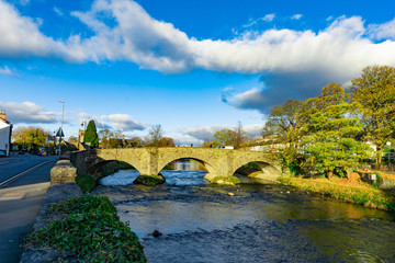 Fototapeta na wymiar Cityscape of River Kent at Lound Road in Kendal, Cumbria, England in cloudy blue sky day