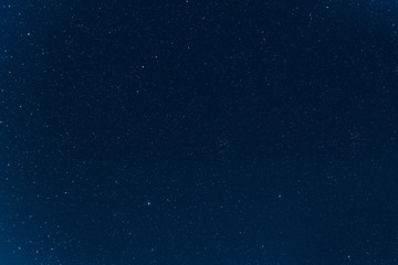 Naklejka na ściany i meble Night blue sky with stars. The texture of a blue sky with stars.