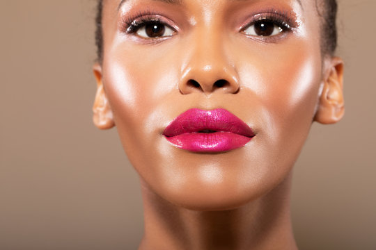 beauty porter young girl with perfect skin and makeup. African American. bridal makeup - delicate pink tones, wet make-up, shine. sexy plump lips. hair gathered on his head - Image   
