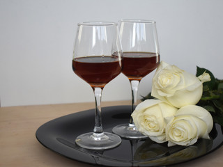 Two glasses of flowers.