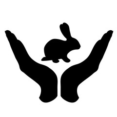 Obraz premium Vector silhouette of a hand in a defensive gesture protecting a rabbit. Symbol of animal, farm,hare, humanity, care, protection, veterinary.