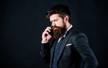 Mobile call concept. Man formal suit call someone. Mobile call conversation. Mobile negotiations. Businessman well groomed mature man hold smartphone. Guy call friend stand black background