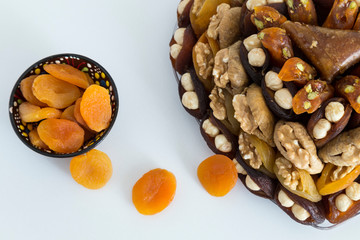 the special dried fruits and nuts plate concept for store seller. dried apricot,fig ,hazelnut, nut,special Turkish east food.