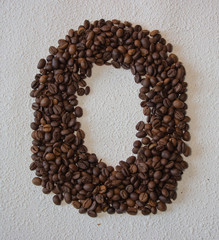 Image of roasted coffee beans shaped alphabet on a white background