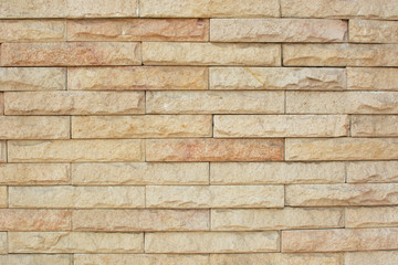closeup brick wall texture background cream and orange color