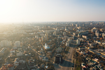Fototapeta na wymiar Aerial Voronezh city midtown panorama at sunset, roads with car traffic and buildings, center of old European city in spring