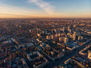 Aerial Voronezh city midtown panorama at sunset, roads with car traffic and buildings, center of old European city in spring