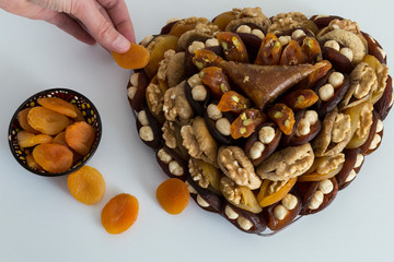 the special dried fruits and nuts plate concept for store seller. dried apricot,fig ,hazelnut, nut,special Turkish east food.