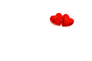 Two sparkling hearts together on white background