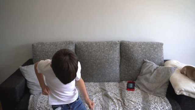 Little boy dancing at home