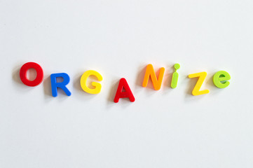 Concept organize word spelled with colorful letters on white background