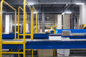 Automated warehouse. Boxes moving on conveyer