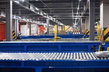 Factory roller conveyor system for transporting crates
