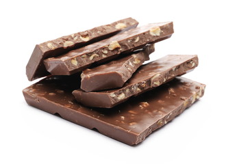 Chocolate with hazelnuts isolated on white background