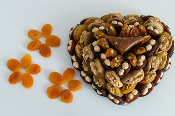 the special dried fruits and nuts plate concept for store seller. dried apricot,fig ,hazelnut, nut,special Turkish east food.