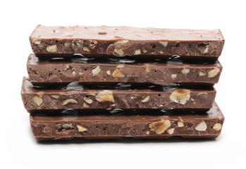 Chocolate with hazelnuts isolated on white background