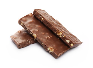 Chocolate with hazelnuts isolated on white background