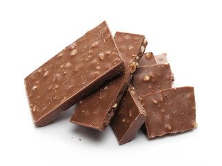 Chocolate with hazelnuts isolated on white background