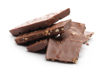 Chocolate with hazelnuts isolated on white background
