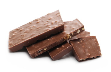 Chocolate with hazelnuts isolated on white background