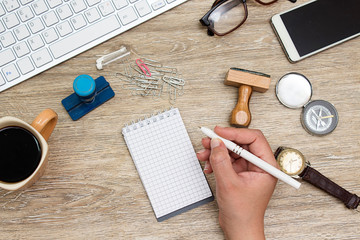 keyboard, glasses, stamp, pen coffee cup and notebook