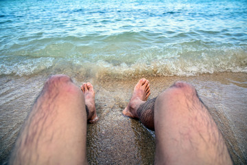 Man is on beach at sea travel in summer holidays