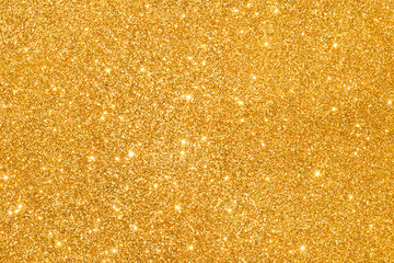 sparkles of golden glitter abstract background