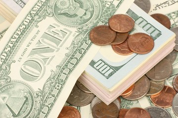 Calculator on banknotes with a pen and pencil. Limited depth of field