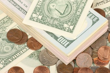 Calculator on banknotes with a pen and pencil. Limited depth of field