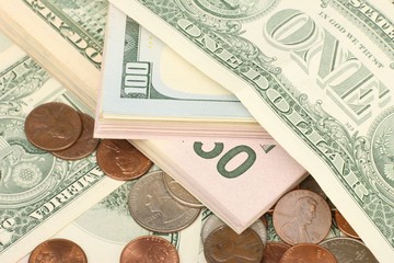 Calculator on banknotes with a pen and pencil. Limited depth of field