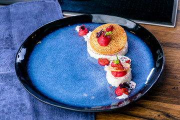 Yogurt and white chocolate mousse with raspberry cream. French cuisine. The work of a professional chef. Dish from a restaurant or cafe menu. Close-up