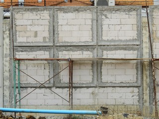 aged street block wall in construction site