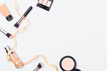 Feminine cosmetics and makeup brushes