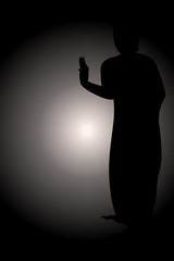Silhouette standing Siddhartha gautama with monochrome glowing background