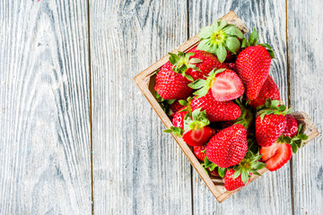 Fresh strawberry on wooden box, copy space