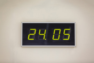 Black digital clock on a white background showing time 24.05