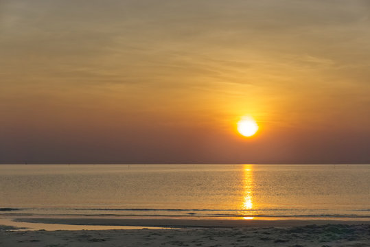 sun rise on the ocean, sun rise on the beach © chakawut