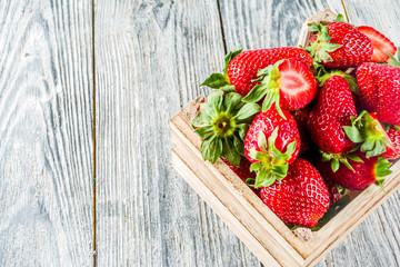 Fresh strawberry on wooden box, copy space