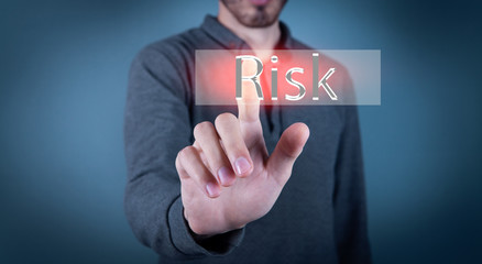 young man presses text risk