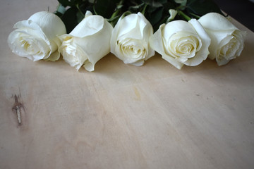 White roses on the table.