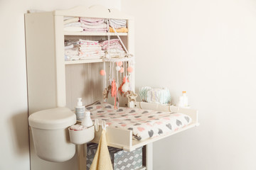 Baby changing table in light bedroom