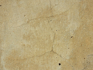 old brown concrete wall with crack texture